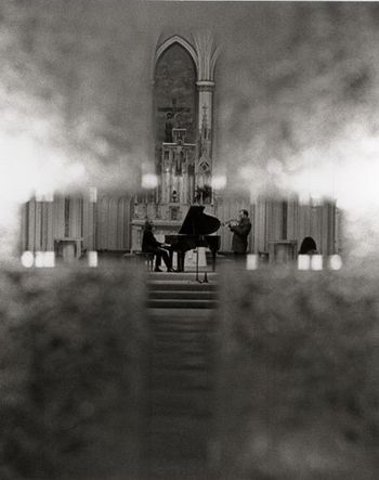 NORTH BEACH JAZZ FESTIVAL A beautiful photo by Scott Chernis, through the frosted window, of Grant & Matheny performing at the Shrine of St. Francis.

