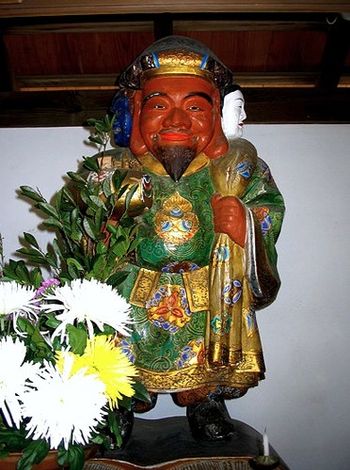 This is the Daikokuten statue at KOSHOJI. Daiko is a "god of good fortune," associated with trade and the accumulation of wealth. For good fortune in business, it is customary to light incense at his small altar.
