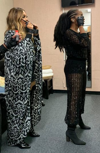 Sheri Hauck in the dressing room discussing stage blocking with Recording Artist Tamia before performance.
