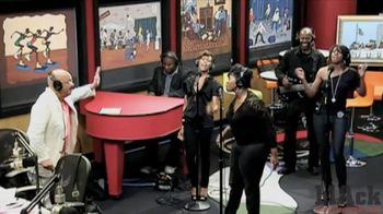 Sheri Hauck performing on CBS behind Grammy nominated recording artist Kelly Price on The Tom Joyner Morning Show.
