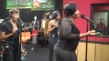 Sheri Hauck performing on CBS behind Grammy nominated recording artist Kelly Price on The Tom Joyner Morning Show.
