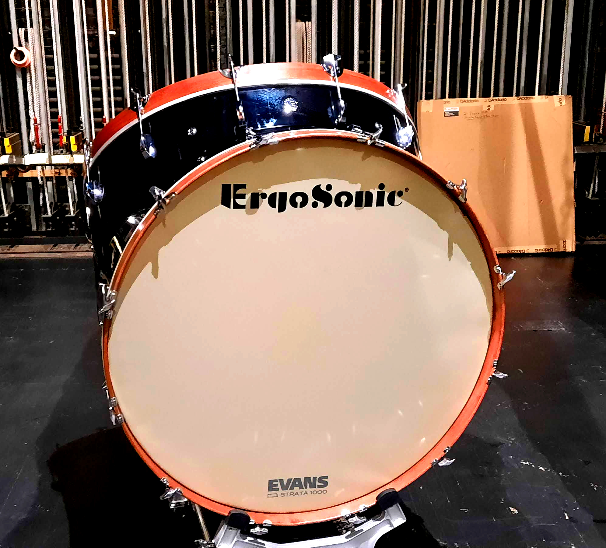 A large bass drum with the word ErgoSonic in black letters on the top of the white drum skin