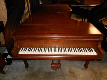 1949 Story & Clark 5.6 ft baby grand. Lots of cat scratches in the original finish,Went under the knife for Satin Ebony
