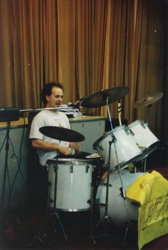 Tom Vest playing 'ROCK' drums, Western Medical University, Chengdu 1991. Students broke through a glass door trying to get into this show.