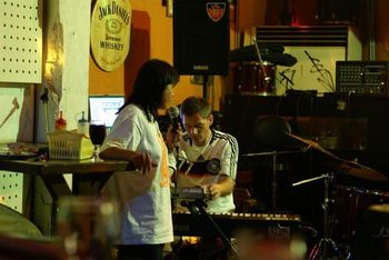 Armory manager Du Mei chanting Tibetan mantras with keyboardist Volker Wiedersheim, Tainan, Taiwan 2008