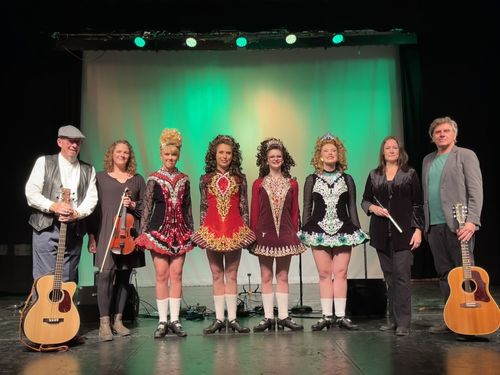 Seventh Town poses with dancers from The Kelly School of Irish Dance at The Stirling Festival Theatre's stage in Stirling, Ontario
