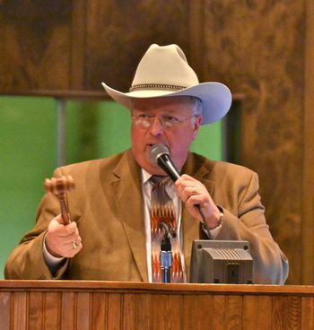 Two great past times, llamas and auctions. Darrell auctioneering the Celebration Sale, Oklahoma City, OK

