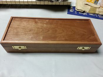 Cherry case with light cherry stain.
