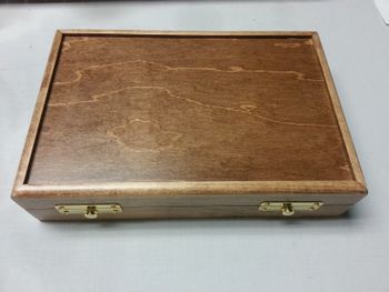 Maple case with walnut stain.
