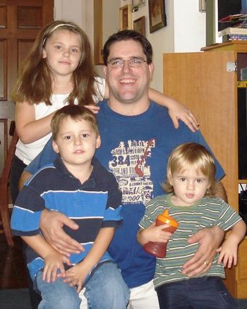 Marsha's son, John, with daughter Bri, and sons John Jr. (JJ) and little Caleb.
