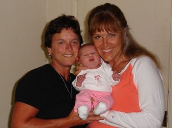 Cindy and Marsha hold Joanie, Naomi and Chris' first baby.

