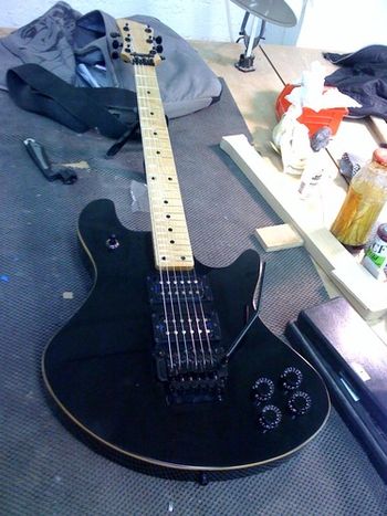 First guitar I ever made. No name for it yet. Body: Mahogany with Maple Top Neck: Maple Neck Joint: Bolt On Scale: 24 3/4 Frets: 24 Fretboard: Maple Nut: Locking (Black) Bridge: Schaller Floyd Rose (Black) Tuning Keys: Gotoh (Black) Controls: 2 Volume, 2 Tone, 3 Way Toggle Pots: Four 500K Pickups: Custom Made Pickups similar to the Seymour Duncan JB and 59
