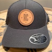 Hat Black with a Round Tan Patch