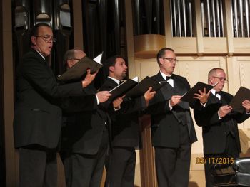 The men's chorus perform.
