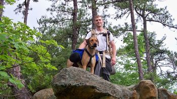 Luke and Nala went backpacking in Kentucky and she had a ball. Check back for some info about their trip. Thanks Luke! Luke writes:" We only got pictures from the first day becase it poured the rest of the time. She did great though. She carried her backpack with no problem and even climbed some rather steep rock faces with a little help. On a couple of occasions she went to chase some squirrels but responded perfectly to "leave it". She was truly in her element and proved herself worthy of more trips."

