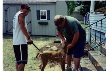This is Tony with his uncle Doug and Allie our first Ridgeback.
