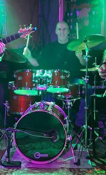 ~ Mike Harris - Drums, Percussion - Mike hails from the D.C. metro area; been playing drums professionally in various genres for 40 years. Studied under Allan Cox in London and Chuck James in Honolulu, he has passion for live performance, putting on a great show of tasty rock favorites, and audiences having a great time they will remember.