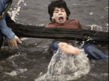 These are still shots from our Super 8mm disaster movie "FLOOD". Bruce and I are trying to save our friend Daniel from the floodwaters; which was just a lake! Why we thought this would pass for a raging flood is beyond me. Anyway, our friend Daniel overacted so much that Bruce and I used to look at these still images and die laughing!
