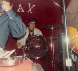 On drums with "WAX"
