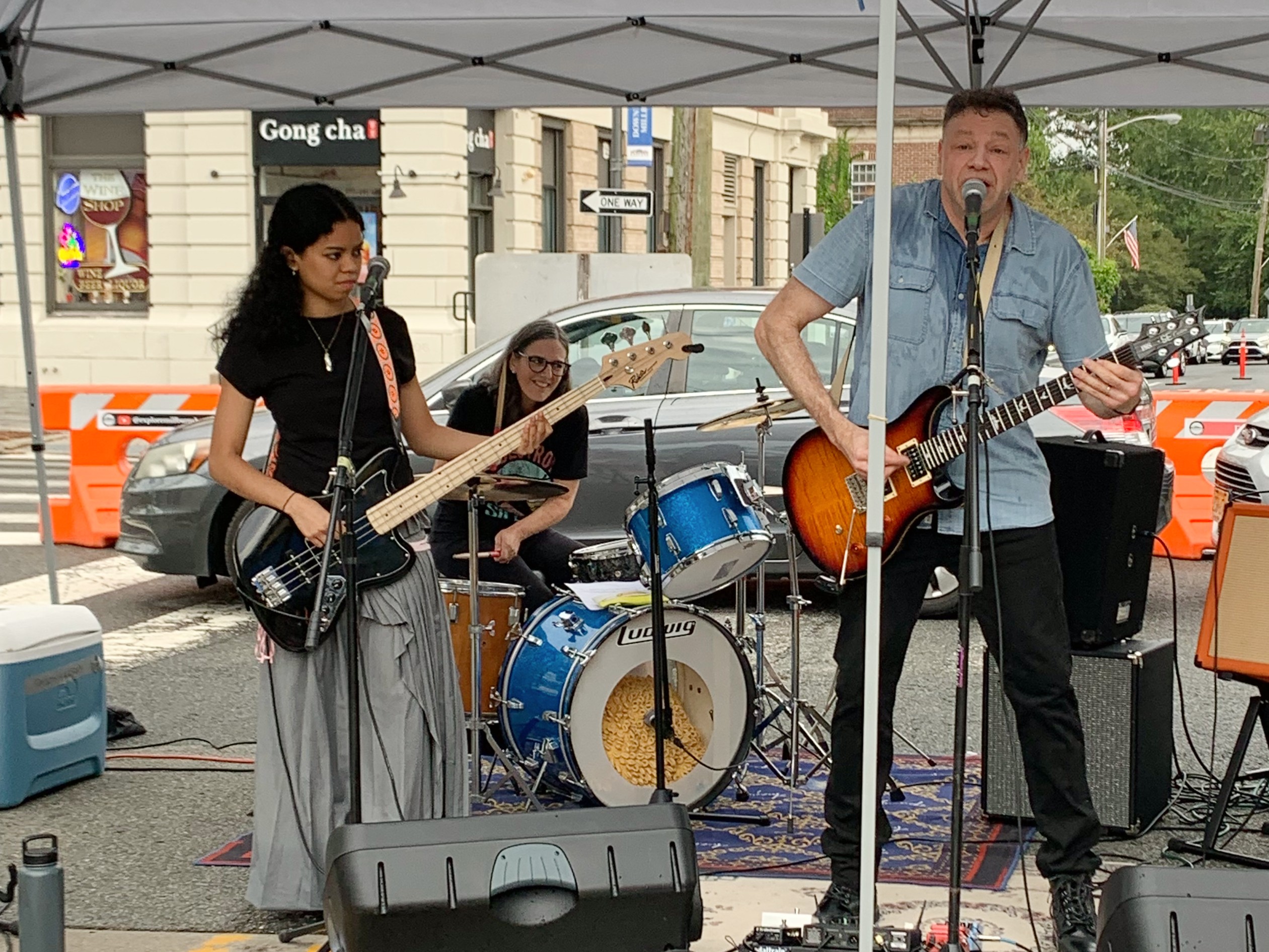 Jason Didner and the Drive perform at Millburn NJ Rocktoberfest 2023. Amelia Chan, Leah Fox and Jason Didner are in this photo. 