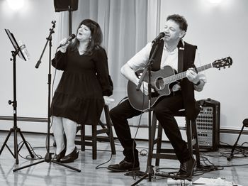 Jason Didner with Leslie Masuzzo performing their duet, "A Moment of Loving Kindness" at a benefit in Montclair April 2023. Photo by Dennis Hill
