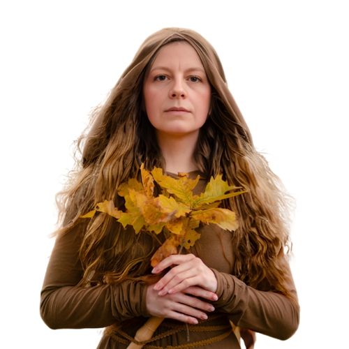 Paula Tait with oak leaves and wooden flute