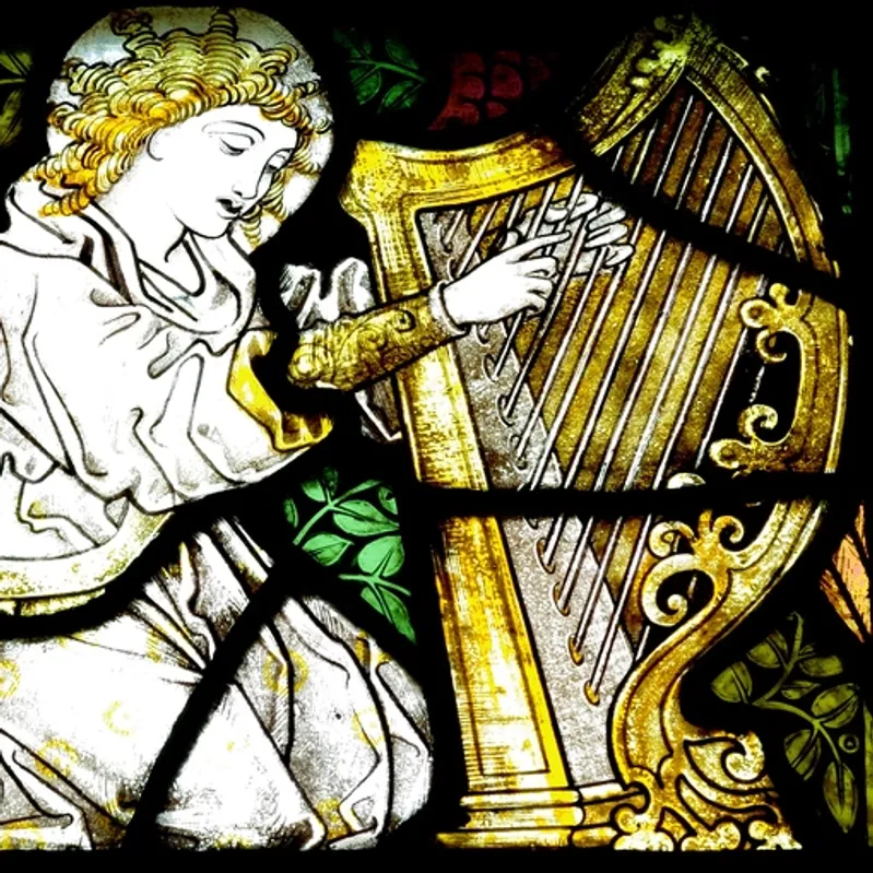 Stained glass window of angel playing an Irish harp