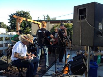 Outdoors on the big flatbed at Slim's.  This time as part of Earfest 3 (2013).
