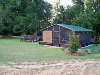 The screen enclosure made the cook shed a lot more enjoyable during spring and summer evenings. Along with the retractactable blinds it added more shade and keeps the bugs out of the burgers.
