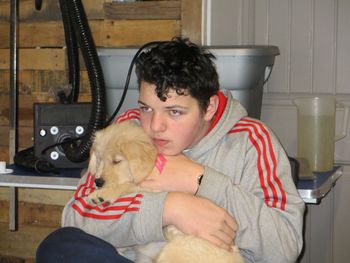 Austin and puppy having a cuddle
