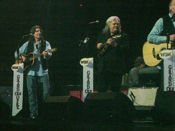 Ricky Skaggs takes the solo during our Opry appearance. Also on stage are George Hamilton V and the IV.
