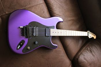 (12/31/13) This is a Charvel SoCal USA made in Candy Plum. The guitar has an Alder body and a raw Maple neck and fretboard with jumbo frets. It has a DiMarzio Evolution in the neck and a Tone Zone in the bridge. It has a Floyd Rose Original bridge. I modded it with a EVH D-Tuna, so the guitar goes from standard to drop D tuning at the pull of a switch. I also replaced the locking nut with a graphite one and put Sperzels locking tuners on. This guitar is just a joy to play and once you pick it up it is so hard to stop playing and put it down again.
