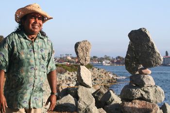 Standing next to his completed sets of balanced rocks
