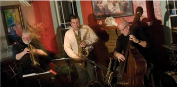 Performing with David Miller (trumpet) and Steve Johnson (bass) in Art Deco Quartet at Cafe Django, Bloomington, IN.  Probably 2006.
