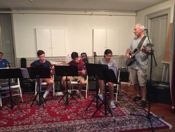 Members of the teen electric guitar class perform "Crazy Train" (L-R, Andrew Egan, Matt Lesser, Zoe Saldana)