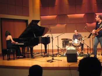 Grinding out some music by Israeli bassist Avishai Cohen with drummer Jeff Asselin and pianist Lika Pailodze. In Clarke Hall at U Miami in 2011