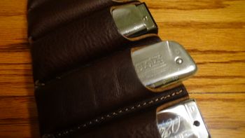 If you force it in, the bandolier will hold Golden Melody harps...good luck getting them out though!