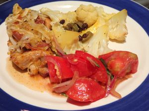Paprika chicken thigh with prsciutto and leek, tomato with red onion and basil & roasted cauliflower with olives and dried currants.