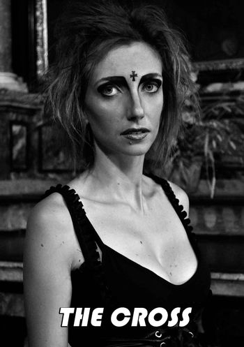 The Cross (Dark Christianity) as seen in the short film "Darwin's Tears". She is the personification of corrupted, fanatical Christianity, a creation of ZZ-999.