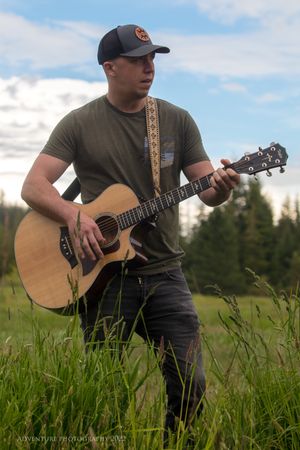 Isaac Olson - Isaac (30) plays the mandolin, acoustic guitar, writes songs, sings, and promotes for the band. Isaac graduated from Washington State University with a degree in civil engineering. When he isn't putting on a show he likes to spend time with family, his son cooper, his dogs and he just loves to be outside.