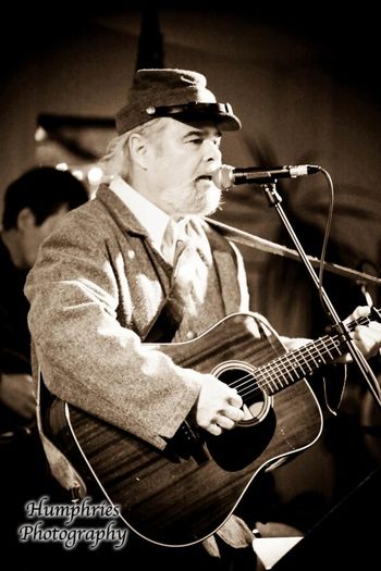 This is Bob. He plays bass, mandoline and guitar. Not sure where this picture was taken or if that is even the real Bob.