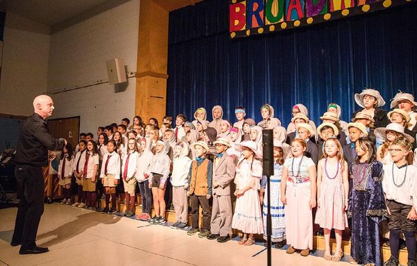 Paul conducting a 4th grade chorus in his hometown of Croton on Hudson, NY.