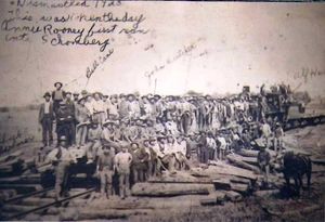 Group photo at the arrival of the S&A at Schomberg in 1902. Note the lack of ballasting. Lots of flatcars. Inscription "Dismantled 1928. This was the first day Annie Rooney first ran into Schomberg". It is not clear whether 'Annie Rooney' was the nickname for the railway or the engine. Judging by the curve, this image was likely taken from the 9th Concession (Hwy 27) looking east. Len Appleyard Collection