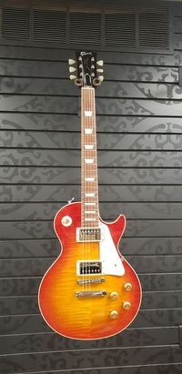Gibson Custom Shop's 1959 Les Paul Standard Reissue is not just a tribute to the priceless original models -- it's a clone of them. From laser-scanned dimensions to chemically-recreated plastics to color-matched shades of sunburst, every element has been rendered in unbelievable detail. It represents the culmination of decades of work by Custom Shop's expert team -- a tireless quest to bring accuracy and authenticity to the hands of fans. It’s the definition of cool, and it's the best representation of the 1959 Les Paul Standard. Call for availability and pricing.