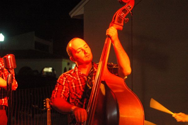 Mike Daley AKA his own wingman. Mike has been playing bass for about 9 years. He may be the shortest member of the band but he plays the biggest instrument. He is really cool.... just ask him and he'll tell you all about it. Mike is usually the highest person in the band. That is because he is a pilot in the USAF so his altitude.. or attitude, I forget but it is just part of the deal. If he isn't home he is somewhere else...just look up. He is normally out and about on the weekends! If you see him say hello!