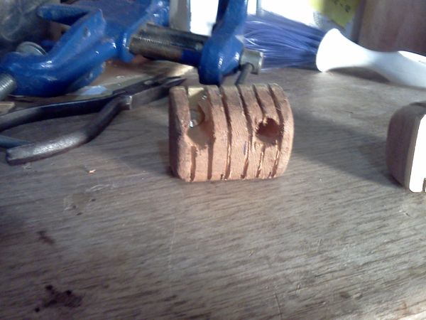 7/1/14 - #14 - Here is the head block / string retainer with slots roughed in, from the top view. I did not anticipate the redwood to split away between the string grooves, but we'll see what tomorrow brings...