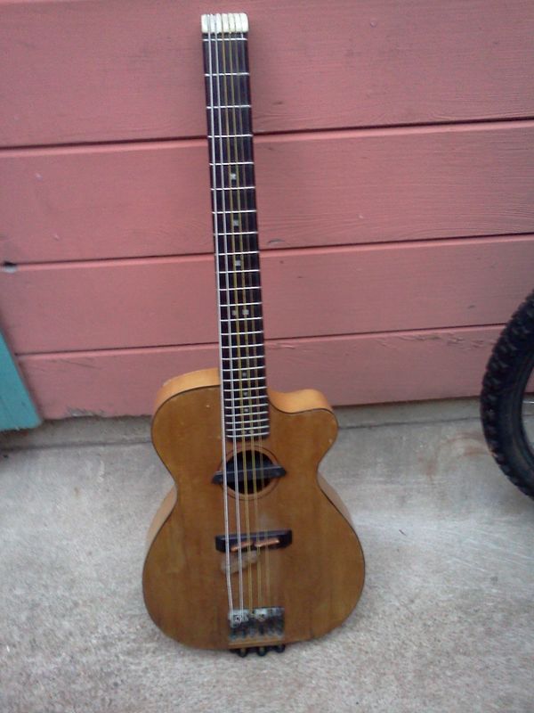 6/30/14 - # 8 - Originally built as an approximation of a Martin 00-15, but with a cutaway and in headless form. This has been my all time favorite instrument. It sounds great in standard tuning, but really kicks it, in DAEBF#D tuning. Number Eight has a Fishman Rare Earth in it, and sounds awesome on stage, or in the studio. It has been my go to instrument for recording, and playing nice places.