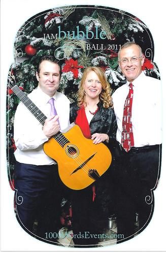 I played the harp-not the guitar-at the Columbia Tower Club in Seattle for a group of 300 event professionals. Here I am with the other 75th Floor "band"--the Chris Bayman Guitar Duo. Dec 2011. Photo by 1000 Words