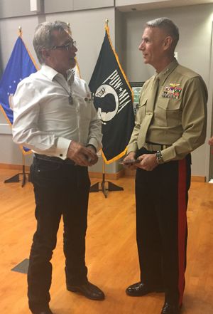 Lieutenant General Rex C. McMillian asks for the CD featuring 'American Flag'.