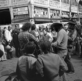 At the Market, 1975. That's Artis in the middle playing spoons. from http://pauldorpat.com/tag/pike-place-market/